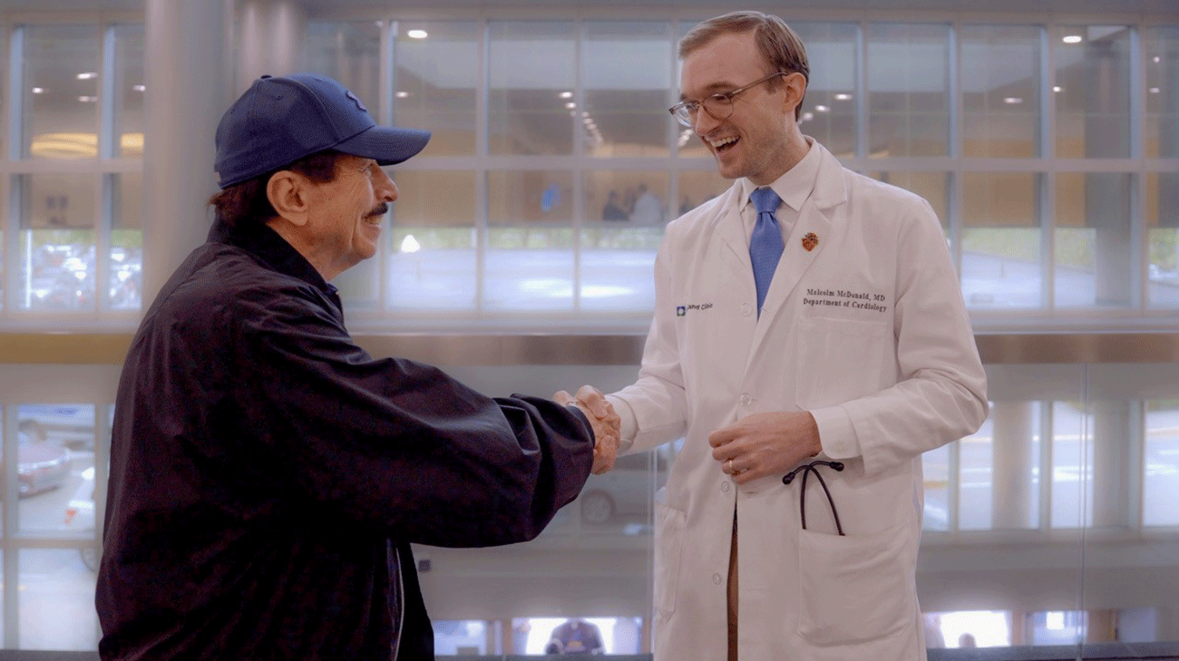 Patient, John Petri, talking with Cleveland Clinic Florida cardiologist, Dr. Malcom McDonald.