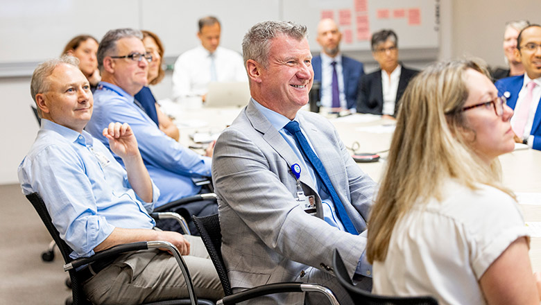 Cleveland Clinic Caregivers sitting around a conference table.