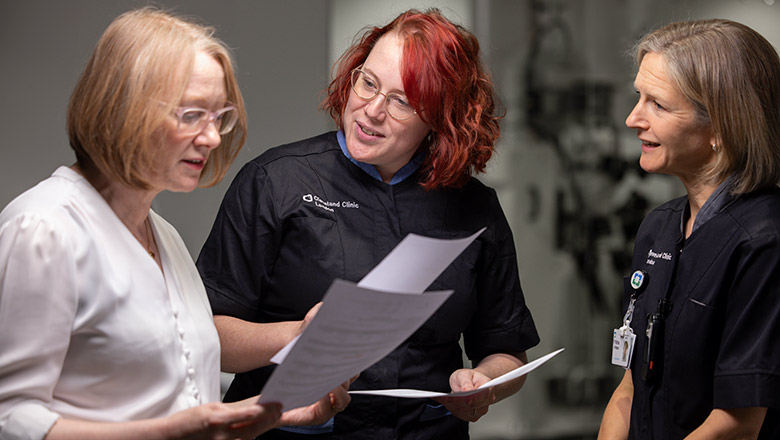 Cleveland Clinic Caregivers looking over charts together.