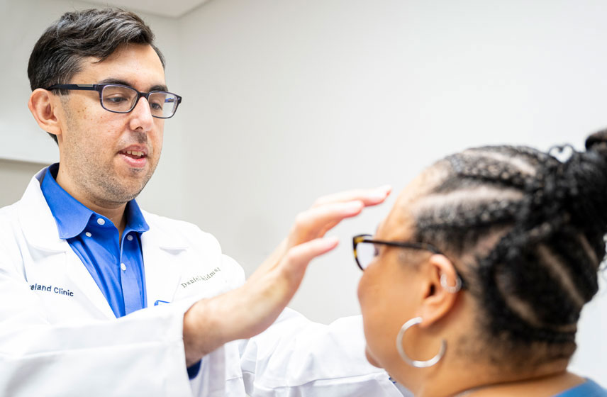 Cleveland Clinic doctor consulting a patient.