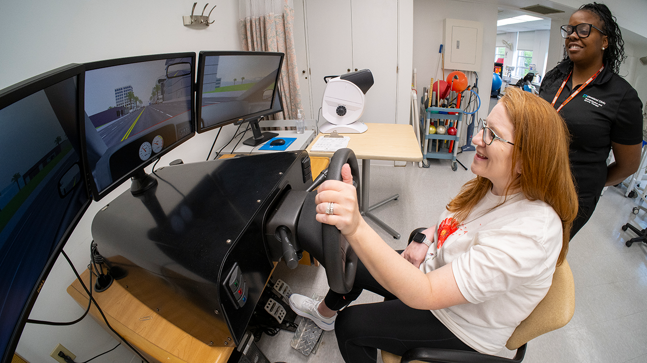 Amanda using driving simulator